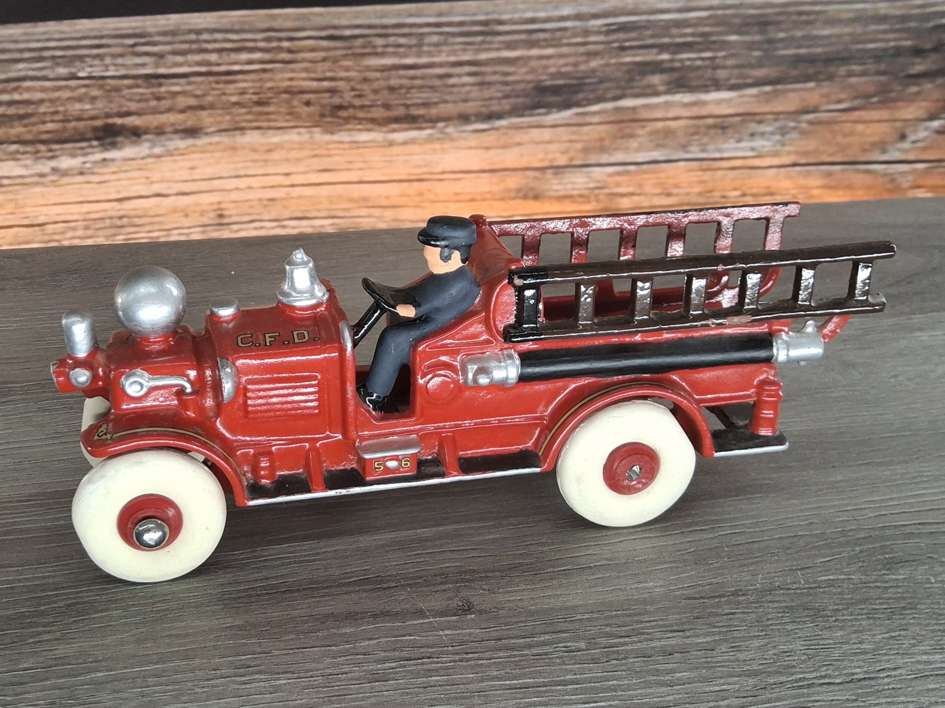 Vintage Cast Iron Red Fire Engine C.F.D. Toy Ladder Truck Driver Figure