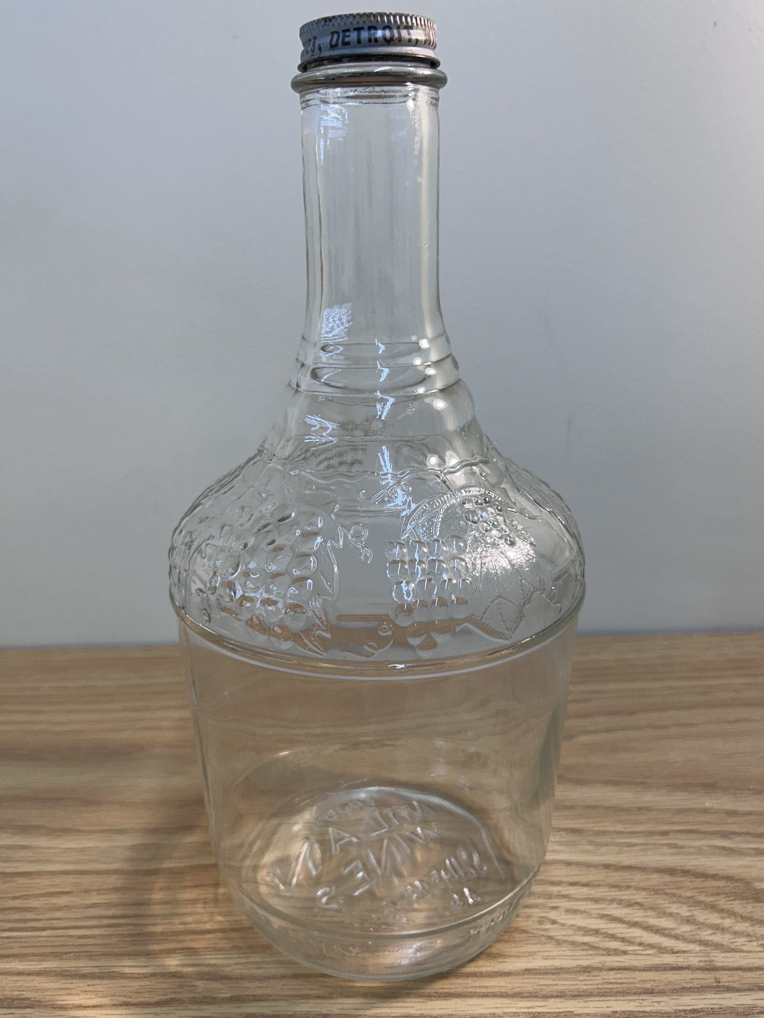 Vintage Embossed Glass Wine Jug