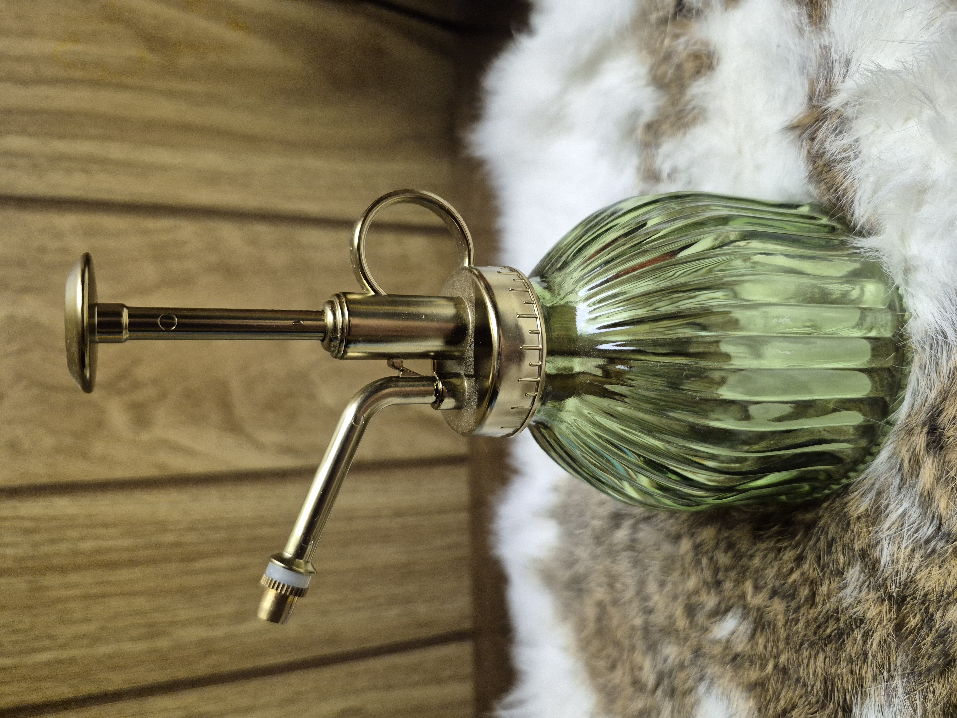 Green glass plant mister bottle with gold hardware